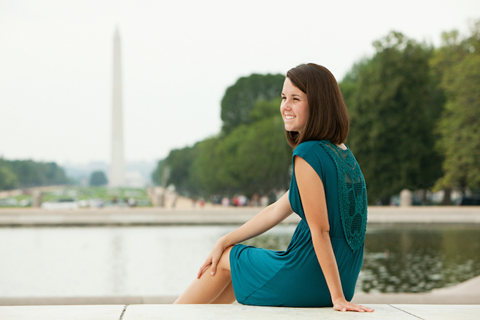 Girl by reflecting pool with washington monument in distance
