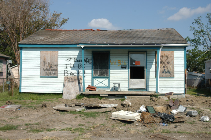 An abandoned house sits among a pile of rubble in New Orleans' Ninth Ward neighborhood after Hurricane Katrina.