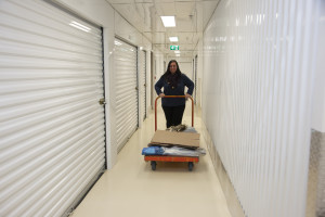person bringing items to a storage unit