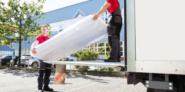loading a mattress in a moving truck