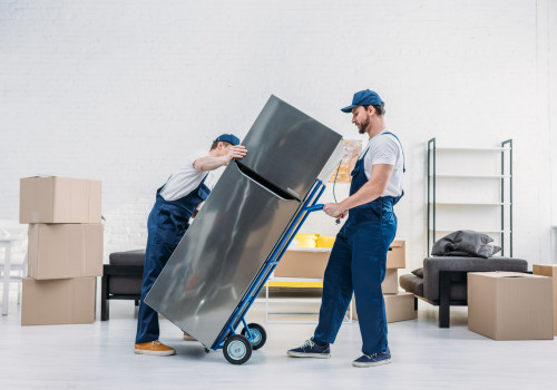two movers moving a refrigerator