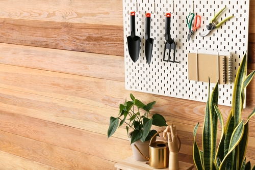 garden tools stored on pegboards