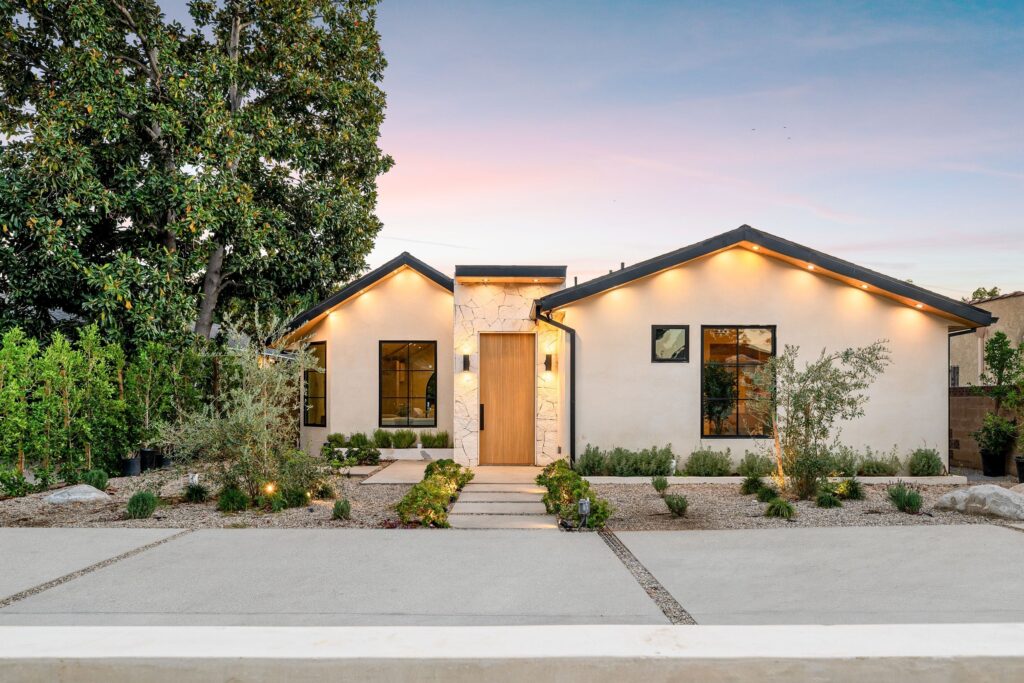 home with warm exterior lighting
