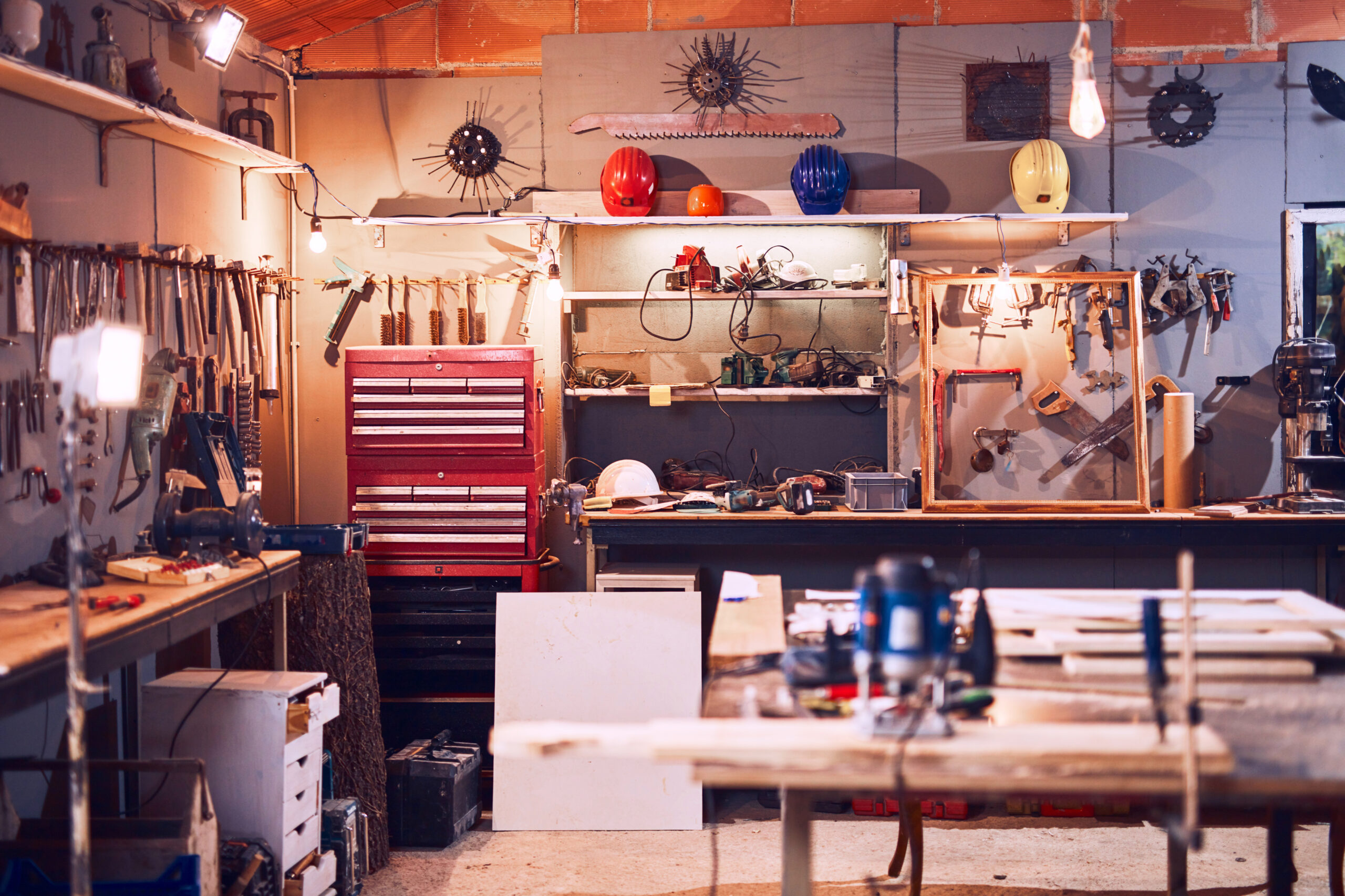 Neatly organized garage with hinging tools and shelves