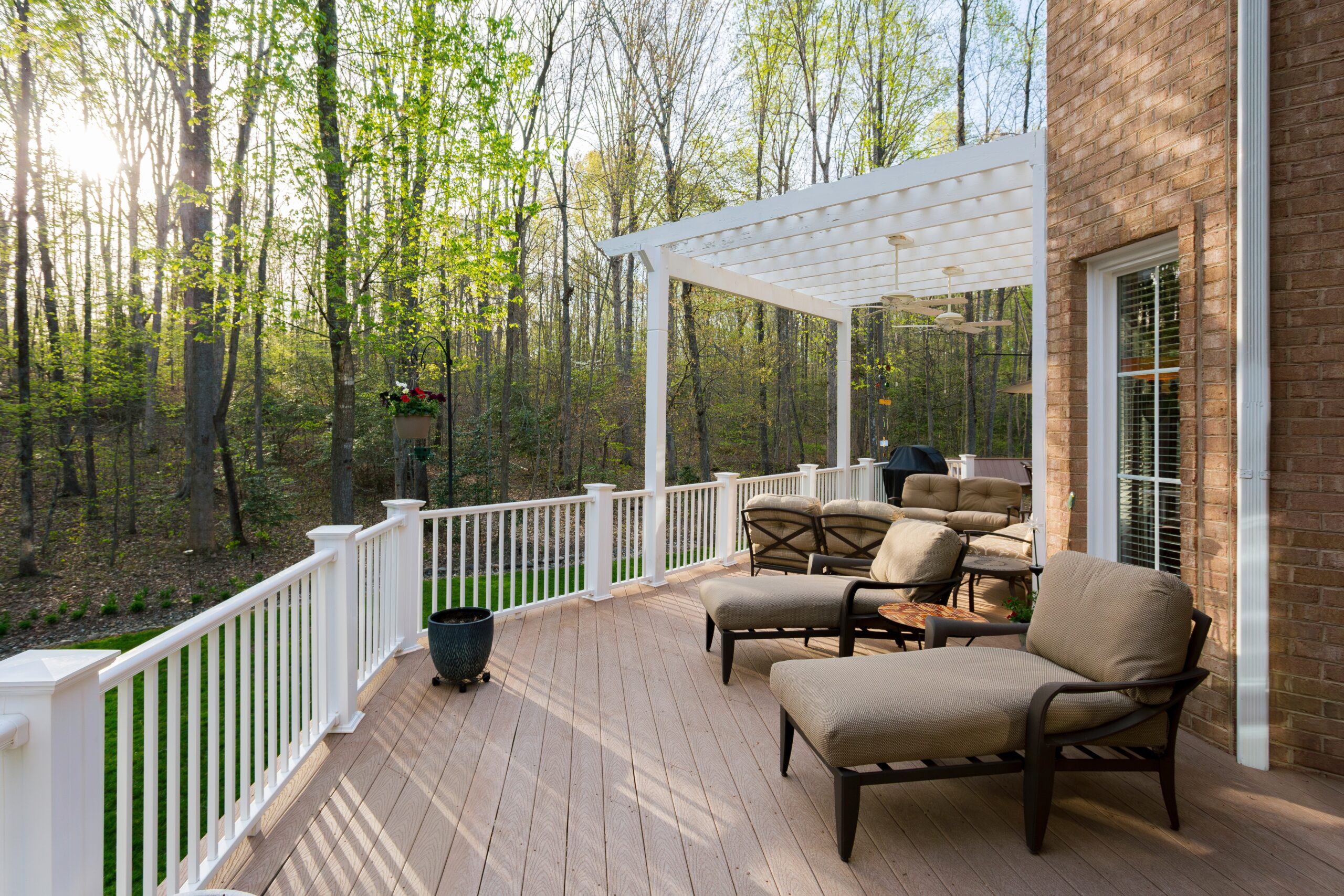 a deck with lounge chairs on a sunny day